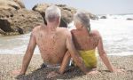 Frisky older people on a beach